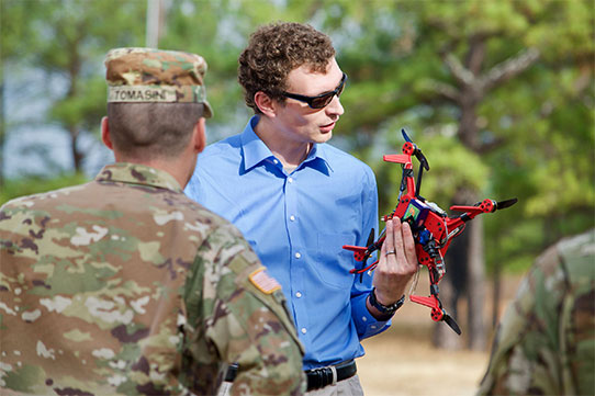 John Gerdes, an engineer with the U.S. Army Research Laboratory, explains the capabilities of the On-Demand Small Unmanned Aircraft System, or ODSUAS, to Soldiers at the Army Expeditionary Warrior Experiments, or AEWE, at Fort Benning, Georgia, Dec. 1, 2016. (Photo: Angie DePuyd)