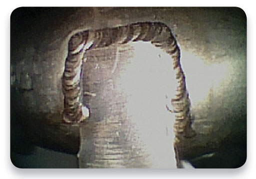 Using a borescope to inspect the welds of the engine nacelle anti-ice system.  (Photo: Hawkeye videoscope.)