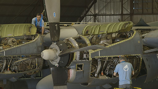 Top: An Embraer Legacy undergoing maintenance in the OGMA Executive Jets Centre.  Above: OGMA engineers work on a C-130’s T56 turboprop engines.