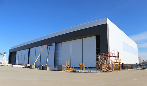 Shown above is Haeco Aero’s new Hangar 4, their fifth hangar in Greensboro, currently under construction. It will serve the same role as their existing hangars, which is heavy airframe maintenance. (HAECO Aero image)