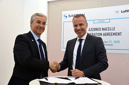 Olivier Savin, Safran Nacelles' vice president of Customer Support & Service and Michael Kirstein, senior director, Aircraft Systems at Lufthansa Technik shake hands after signing nacelle agreement.