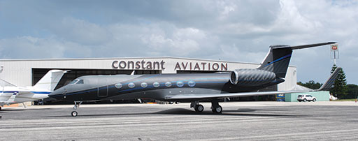 Specialty matte paint from Sherwin-Williams Aerospace Coatings made for a unique look on this Gulfstream. The only gloss paint is the pinstriping between the "carbon fiber effect" on the nacelles, tail and winglets and the blue accent striping. The scheme was laid out by hand. Constant Aviation image.