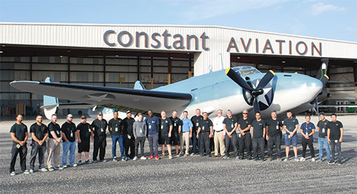 The Constant Aviation paint team is shown here with A PV1 that was a torpedo bomber in World War II. Constant donated the labor and Sherwin-Williams donated the paint for this paint job and the aircraft is now on display.