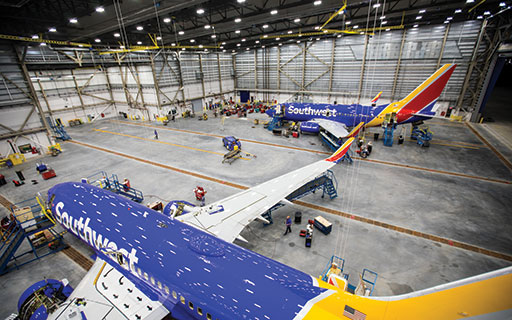Southwest Airlines Mechanics work on Boeing 737s inside the carrier’s new hangar at William P. Hobby Airport