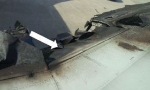 Graphic 2. Left wing and flaps that were severely burned from the fuel fire (NTSB Photo).