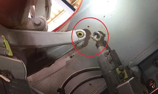 In this Northern HeliCopter AS365-N3 incident, the pilots found cyclic inputs had no effect on the rotor disk. After aborting the flight, they returned to the hangar and found that the left actuator was not connected to the swashplate that redirects the main rotor blades (see image above). Its fastener was missing. They found the bolt, two washers and one Nylon stop crown nut on the gear box compartment below. Operator, via BFU, images.
