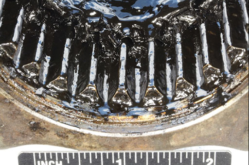 Graphic 5. Compared to the damaged teeth of the inner coupling shown in the previous graphic, this photo shows te mating teeth of the forward outer coupling had only minor wear marks, leading investigators to determine how it failed.   the drive shaft had failed.
