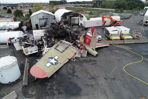 Photo 5: The remains of the Nine-O-Nine at the crash site after the fire was extinguished.