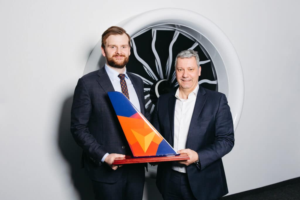 Zygimantas Surintas, CEO of SmartLynx Airlines, and Kai-Stefan 
Roepke, Vice President Corporate Sales EMEA at Lufthansa Technik, 
with a model of a Smartlynx tailfin.  Smartlynx images.