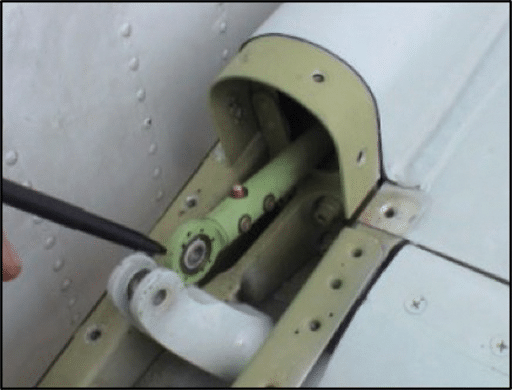 Graphic 7 - Photograph of an exemplar DC-8 right elevator control tab pushrod, shown disconnected, but centered between the lugs of the crank fitting.