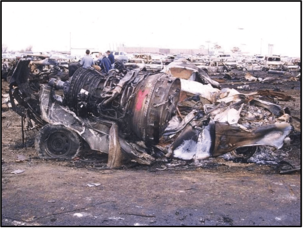 Graphic 5 - One of the four engines from the DC-8 at its final resting site in the automobile salvage yard. Investigators verified that all four engines were operating properly during the accident flight.